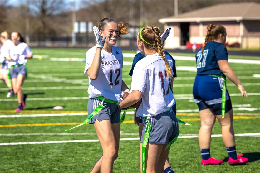 Students play flag football